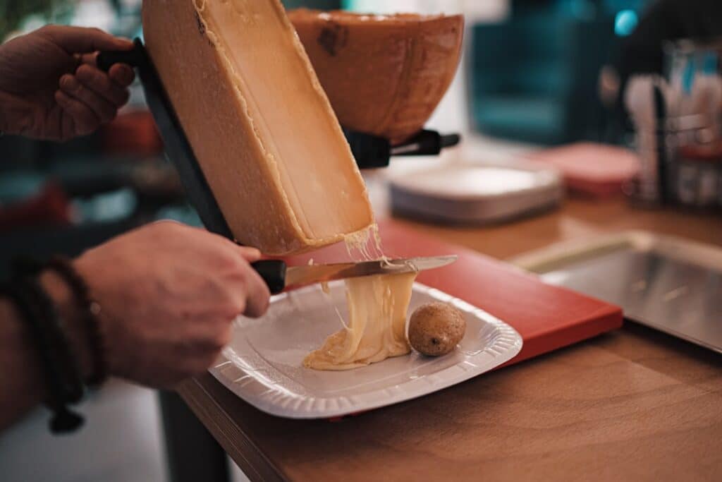 discover the delightful world of raclette, a traditional swiss dish that melts cheese to perfection. learn how to prepare and enjoy this indulgent culinary experience with tips on pairing, cooking methods, and serving suggestions for a cozy gathering or festive celebration.